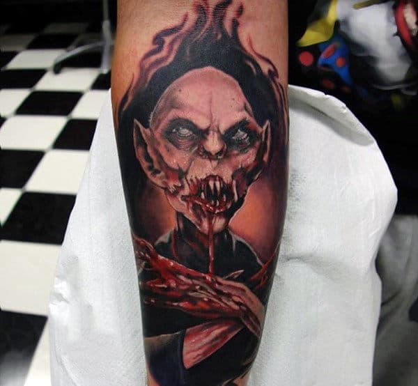 vampire-with-bloody-mouth-tattoos-for-men-on-arm