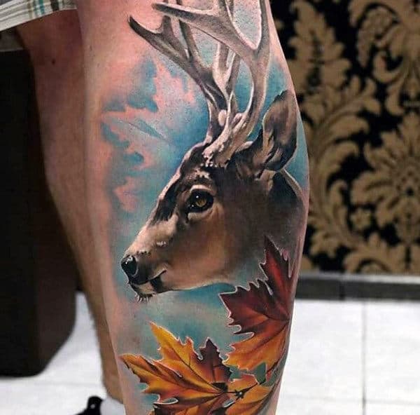 full-color-mens-leg-calf-deer-tattoo-with-blue-sky-and-orange-leaves