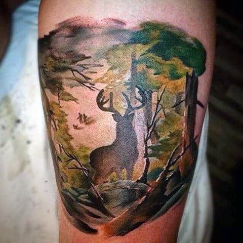 mens-bicep-tattoo-of-deering-roaming-through-the-woods