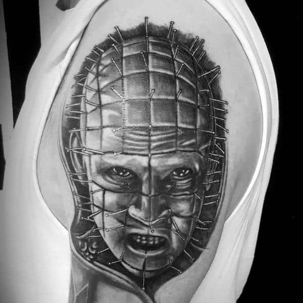 man-with-horror-movie-tattoo-design-hellraiser-portrait-on-arm