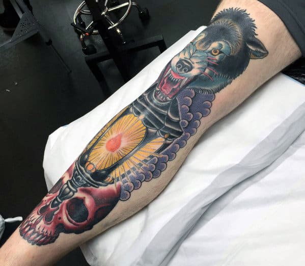 mens-leg-wolf-with-skull-and-lantern-traditional-old-school-tattoos