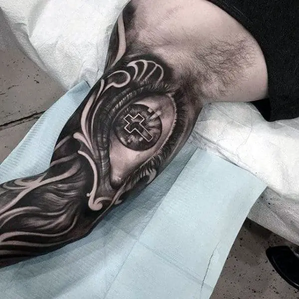 3d-eye-with-cross-mens-badass-inner-arm-sleeve-tattoo-ideas-1