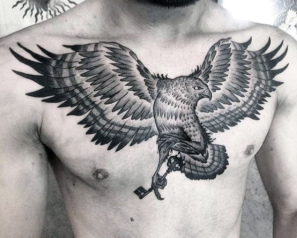 black-ink-guys-falcon-flying-with-key-chest-tattoo-designs