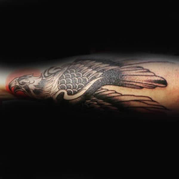 falcon-with-red-gun-outerforearm-male-tattoo-designs
