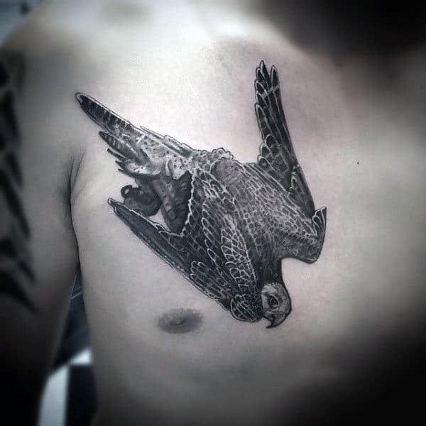 flying-falcon-mens-shaded-ink-upper-chest-tattoo-design-ideas