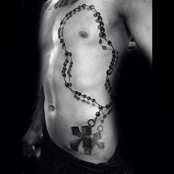 rosary-arm-tattoos-men-on-ribs-1
