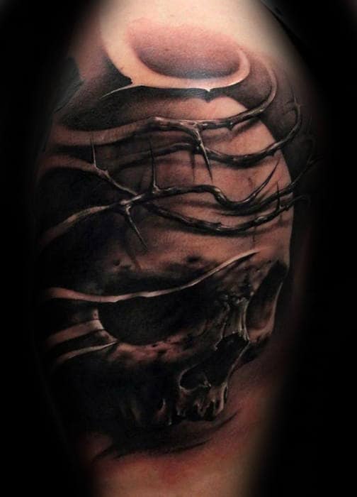 gentleman-with-3d-tattoo-of-thorns-and-skull-arm-upper-arm