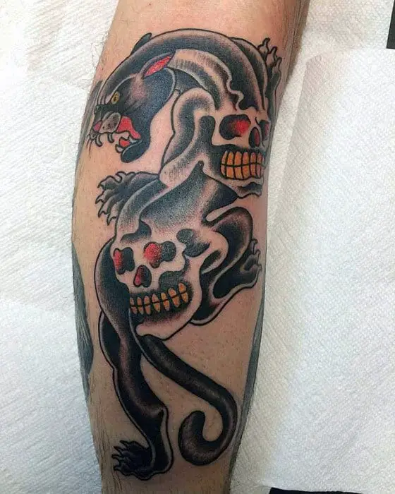 traditional-panther-with-skulls-mens-leg-tattoo