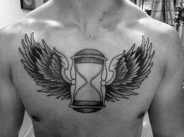 black-and-grey-ink-shaded-winged-traditional-hourglass-guys-chest-tattoo