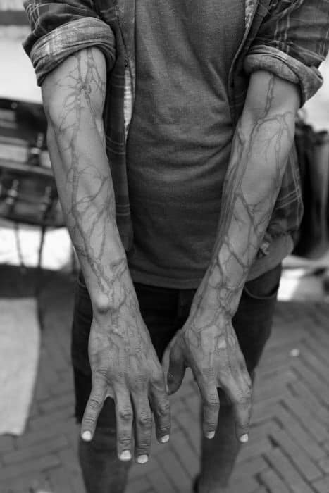 black-ink-lines-tree-roots-full-arm-tattoos-for-men