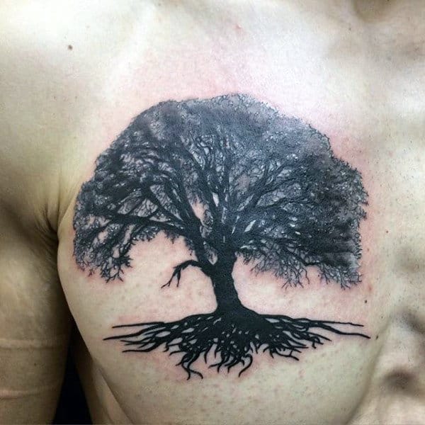 cool-mens-upper-chest-tree-roots-tattoo