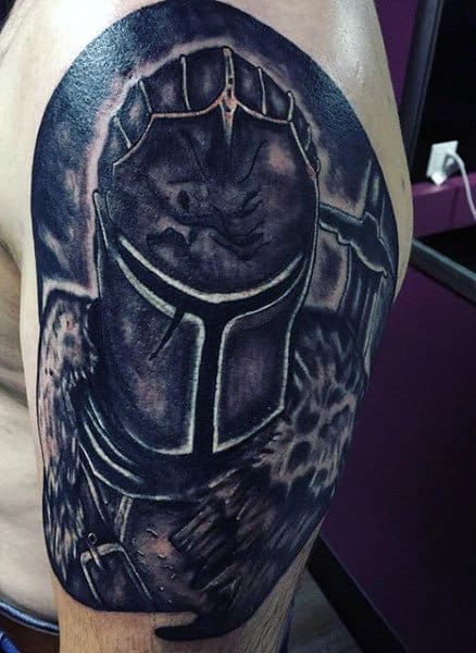 knight-helmet-tattoo-on-mens-arm