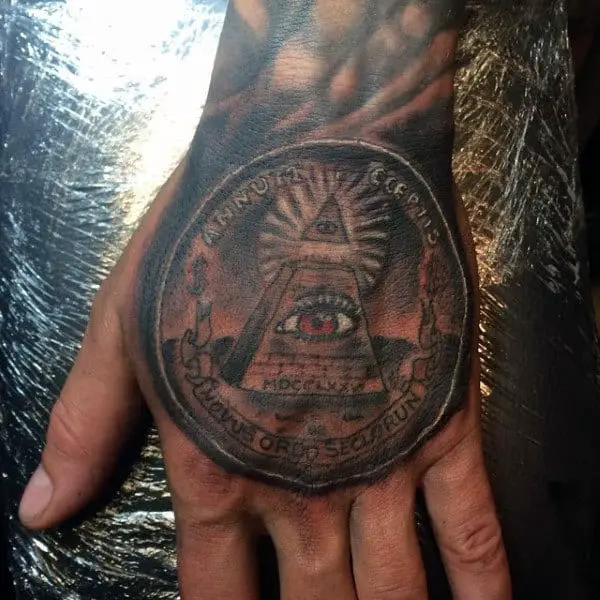 man-with-tattoo-of-money-on-hand