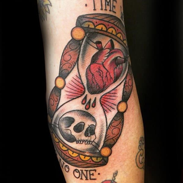 mens-traditional-hourglass-with-heart-and-skull-tattoo-on-forearm