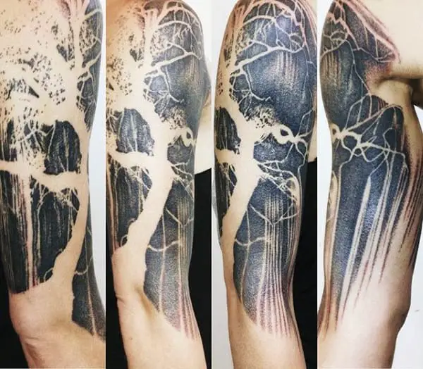 mens-watercolor-negative-space-arm-tree-roots-tattoo