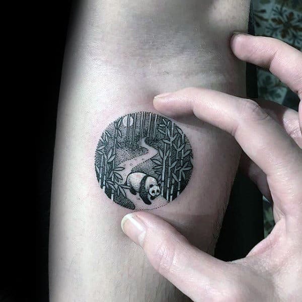 small-circle-panda-in-woods-mens-tattoo-ideas-on-inner-forearm