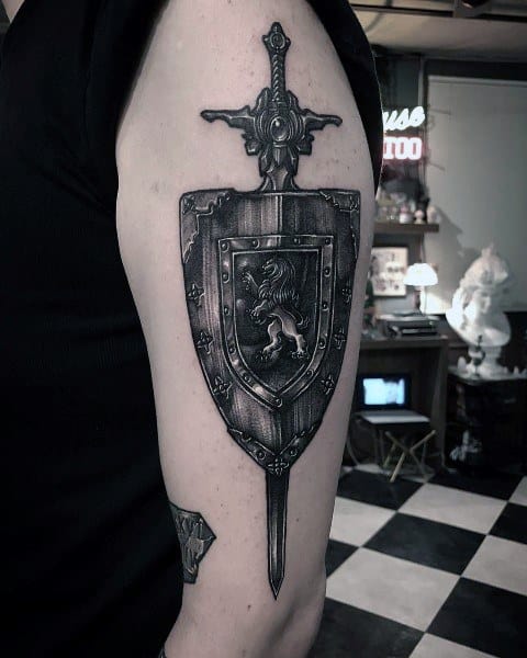 arm-shield-sword-lion-male-tattoo