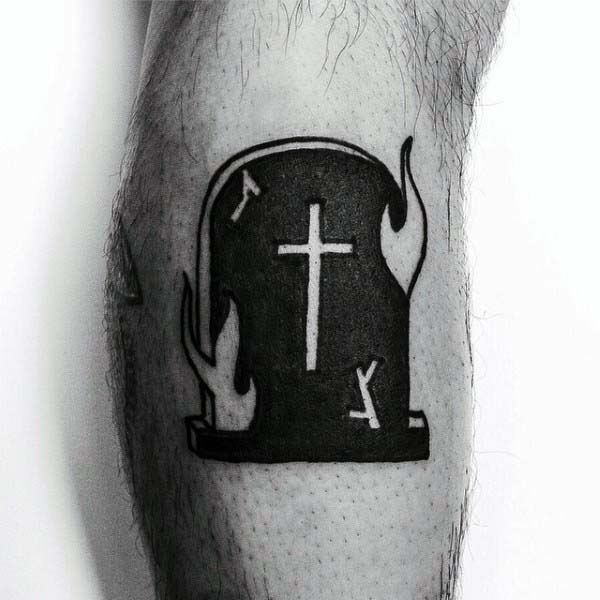 flaming-tombstone-with-cross-negative-space-tattoo-for-guys