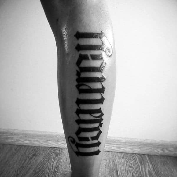leg-calf-ambigram-black-ink-guys-tattoos