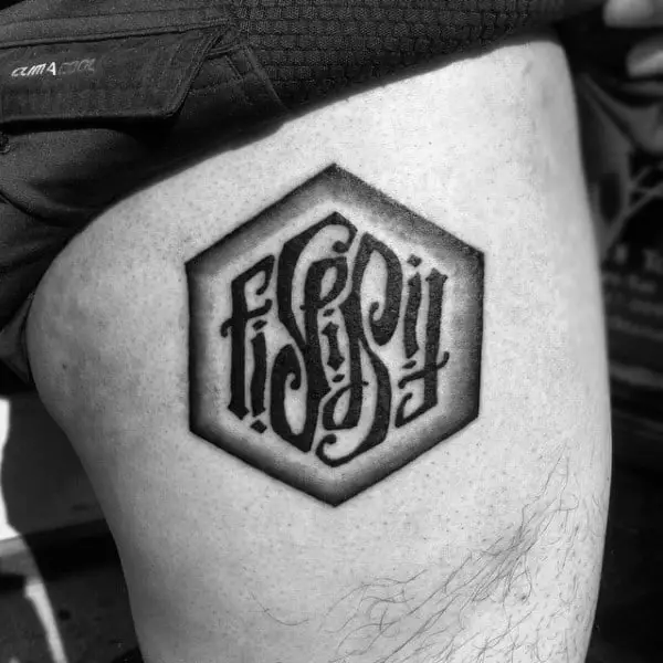 leg-thigh-ambigram-male-tattoo-ideas