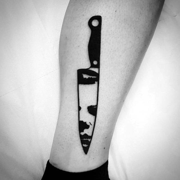 manly-michael-myers-tattoos-for-males-minimalist-knife-design-on-leg