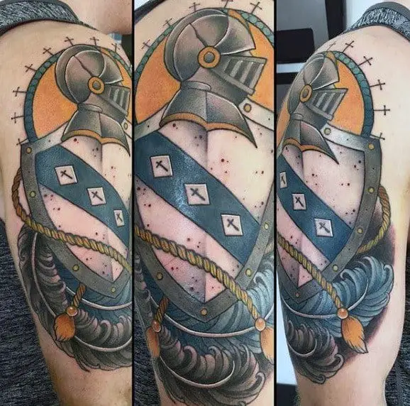shield-knight-helmet-guys-arm-tattoo-with-traditional-old-school-design