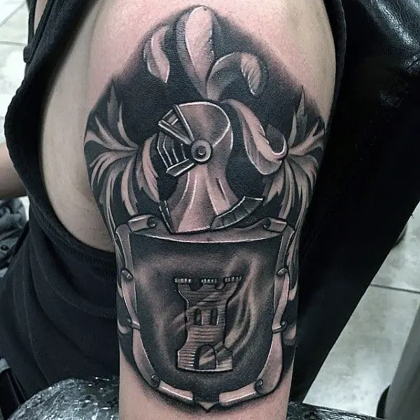 Black And Grey Ripped Skin Family Crest Tattoo On Man Back Shoulder