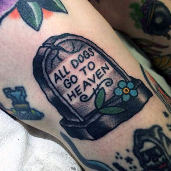 small-mens-tombstone-tattoo-with-all-dogs-go-to-heaven-wording-on-forearm