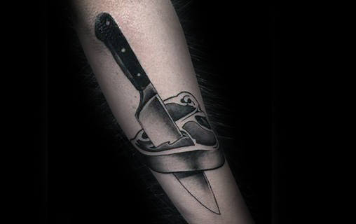 chef-knife-through-steak-mens-forearm-tattoos