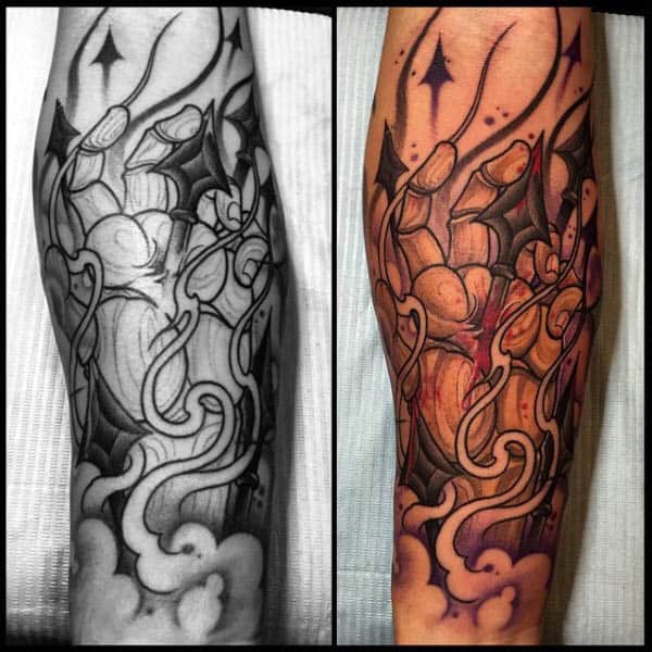 cool-mens-spear-through-hand-tattoo-on-forearms