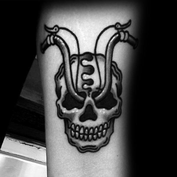 gentleman-with-small-unique-skull-handlebar-traditional-forearm-tattoo