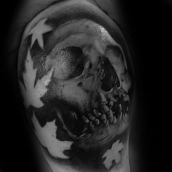 mens-shaded-unique-skull-with-negative-space-leaves-arm-tattoo