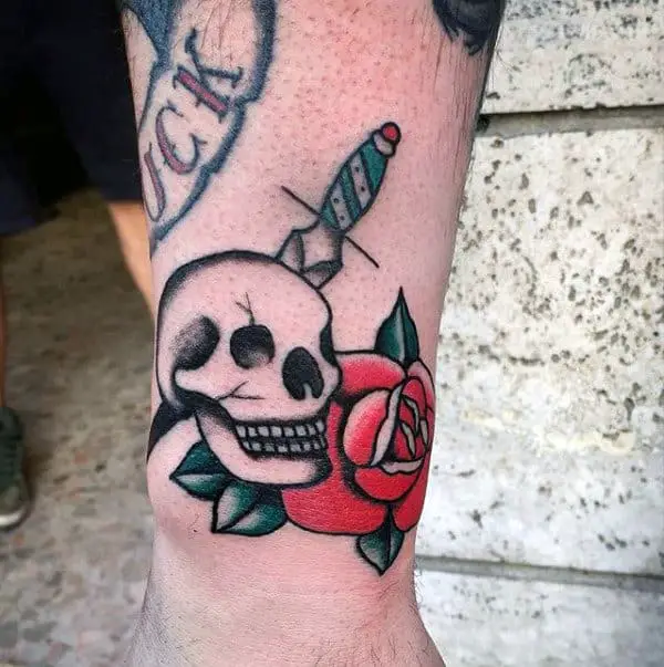 skull-with-dagger-and-red-rose-male-traditional-arm-tattoos