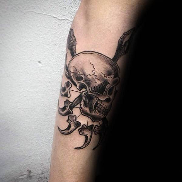 skull-with-spears-mens-outer-forearm-tattoos