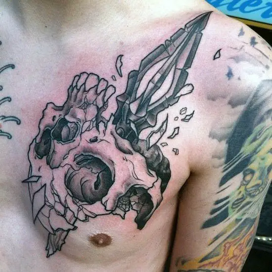 spear-skull-mens-chest-tattoos