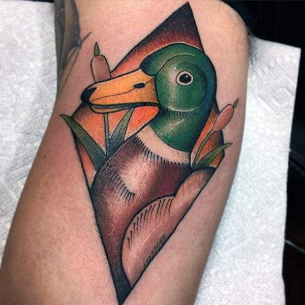 american-traditional-duck-portrait-tattoo-on-guys-inner-bicep