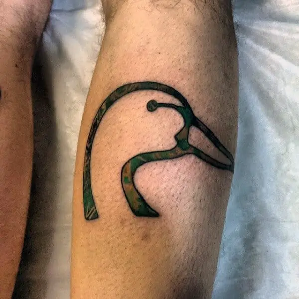 black-linework-simple-duck-head-tattoo-on-guys-leg
