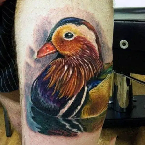 colorful-artistic-duck-on-pond-tattoo-on-guy