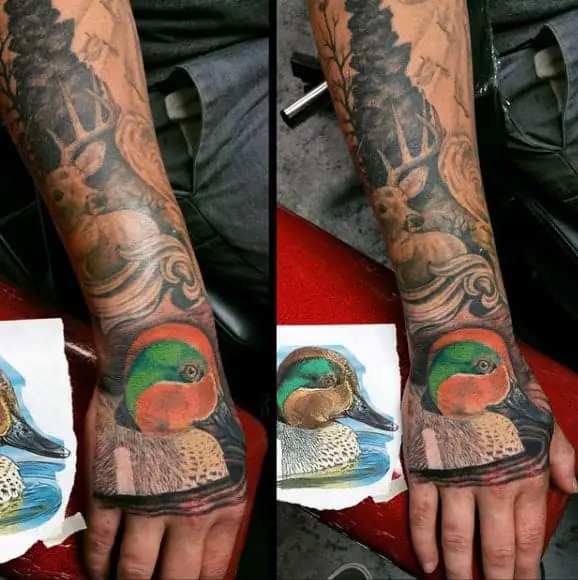 colorful-orange-and-green-duck-tattoo-on-mans-hand