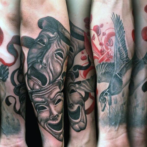 detailed-shaded-duck-and-theater-masks-tattoo-on-mans-forearm