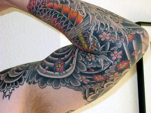 male-with-cherry-blossom-flowers-japanese-traditional-sleeve-tattoo