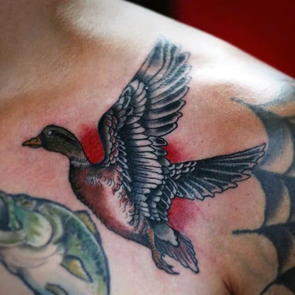 mallard-taking-flight-small-chest-tattoo-on-man