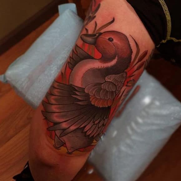 manly-color-tattoo-of-duck-on-pond-for-guys