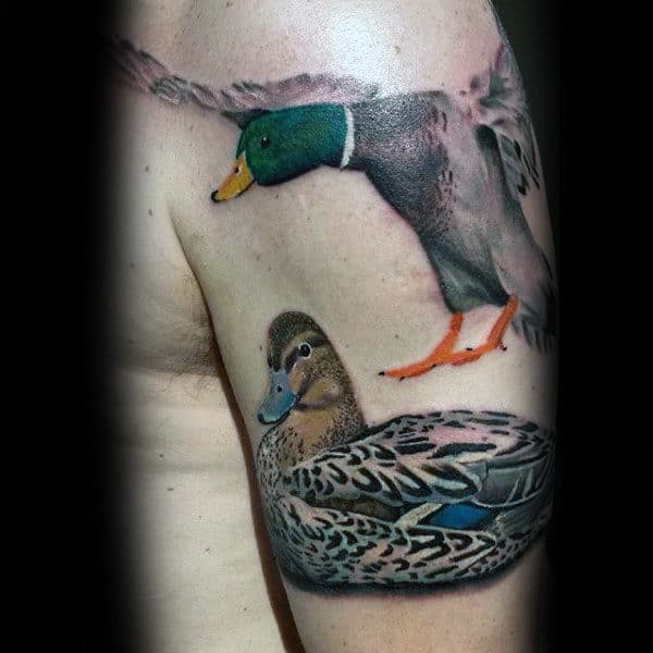 beautiful Colored Flying Duck Tattoo