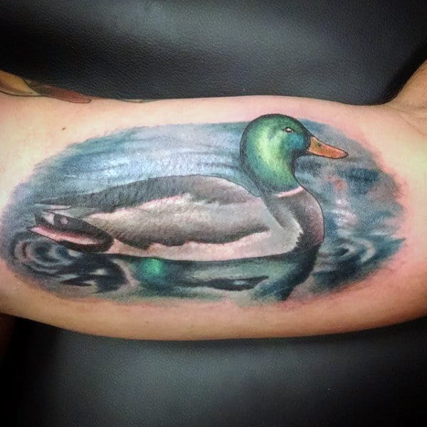 realistic-illustrative-tattoo-of-duck-on-pond-for-males