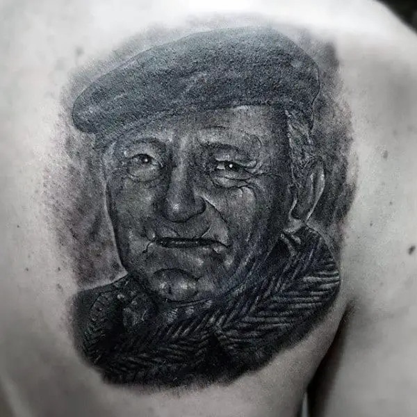 shaded-black-and-grey-ink-guys-grandpa-portrait-tattoo-on-shoulder-blade