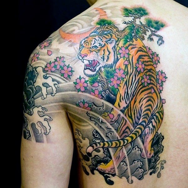 tiger-roaming-through-cherry-blossom-flowers-mens-back-tattoos