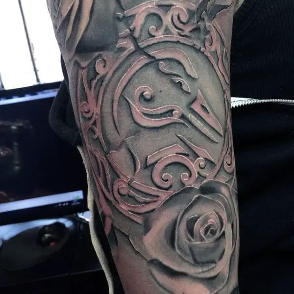 unique-patterned-design-tatttoo-with-rose-and-duck-head-on-man