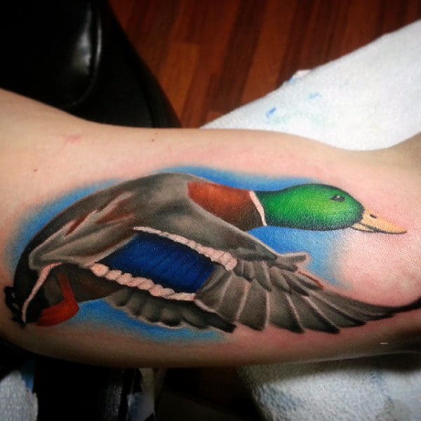 vibrant-illustrative-mallard-with-blue-sky-tattoo-on-male