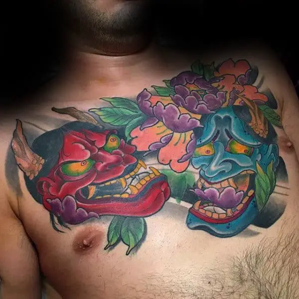 guys-colorful-hannya-masks-tattoo-on-upper-chest